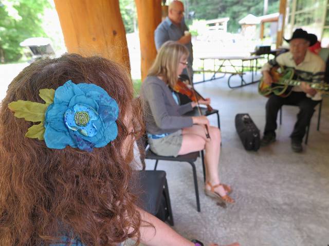 Elissa adorning a back porch session... that's Junior playing 